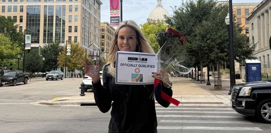 Marie-Lyne Dore celebrating her IRONMAN Wisconsin result